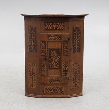 Corner cabinet, dated 1769.