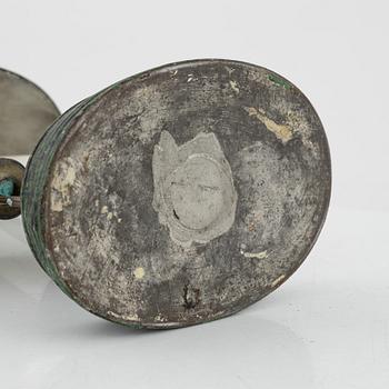 An empire style candlestick, circa 1900.