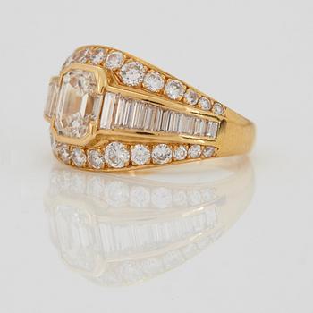 A RING set with an emerald-cut diamond.