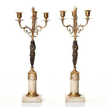 A pair of late Gustavian circa 1800 three-light candelabra.