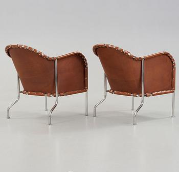 Mats Theselius, A pair of 'Bruno' brown leather and steel easy chairs, Källemo, Sweden.