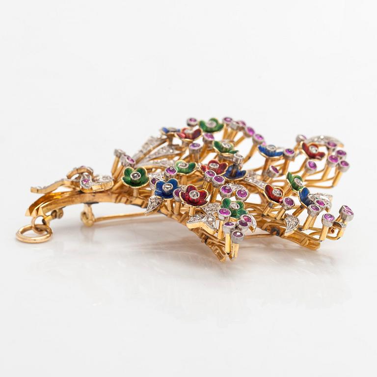 A 17K gold brooch/pendant with rose-cut diamonds, cabochon-cut rubies and enamel.
