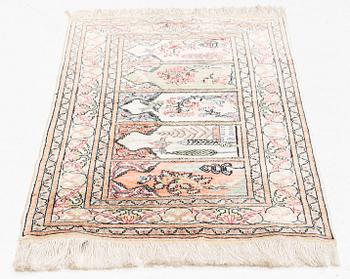 A Kayseri silk rug, c. 110 x 63 cm.