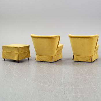 A pair Swedish Modern lounge chairs and a stool, 1940's/50's, the model has been marketed by Gösta Jonsson.
