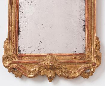 A Rococo giltwood mirror by J. Åkerblad  (master in Stockholm 1758-99), 1775.