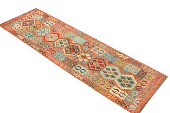 An Afghan kelim runner, c. 301 x 80 cm.