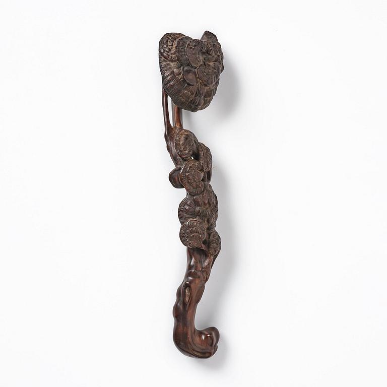 A carved wooden ruyi scepter, Qing dynasty/early Republic.