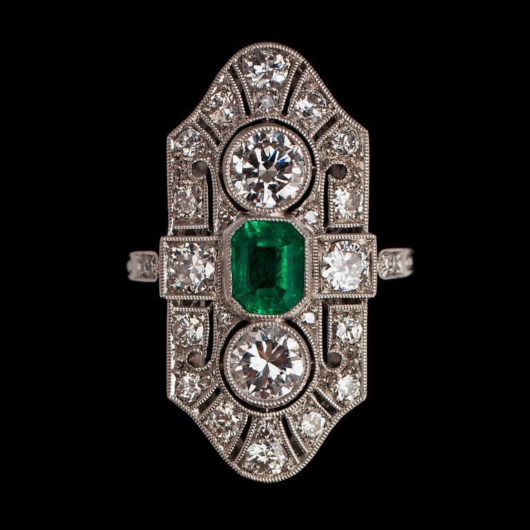 An old cut diamond and step cut emerald ring.