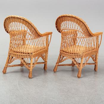 A pair of 1970s/1980s rattan armchairs.