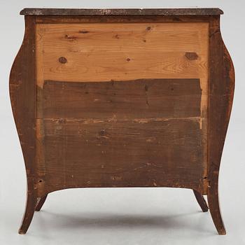 A Swedish rosewood-veneered Rococo chest of drawers, later part of the 18th century.