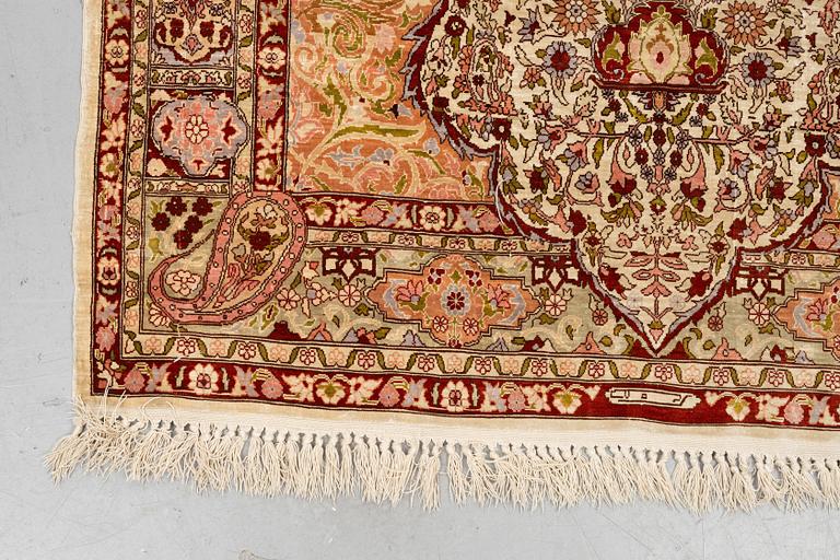A rug, Old silk Hereke, ca 152 x 110 cm.