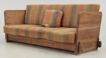 An Axel Einar Hjorth 'Lovö' stained pine sofa, Nordiska Kompaniet, Sweden 1930's.