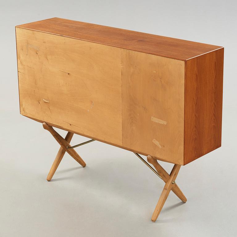 Hans J. Wegner, a teak and oak sideboard, cross-shaped legged by Andreas Tuck, Denmark 1950's.