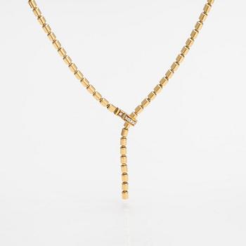 Piaget, An 18K gold "Possession" necklace with diamonds ca. 0.17 ct in total. Marked Piaget D18828.