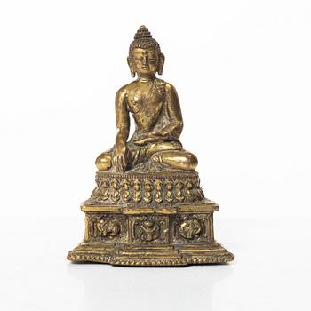 A gilt bronze figure of a Buddha, Nepal, 20th century.