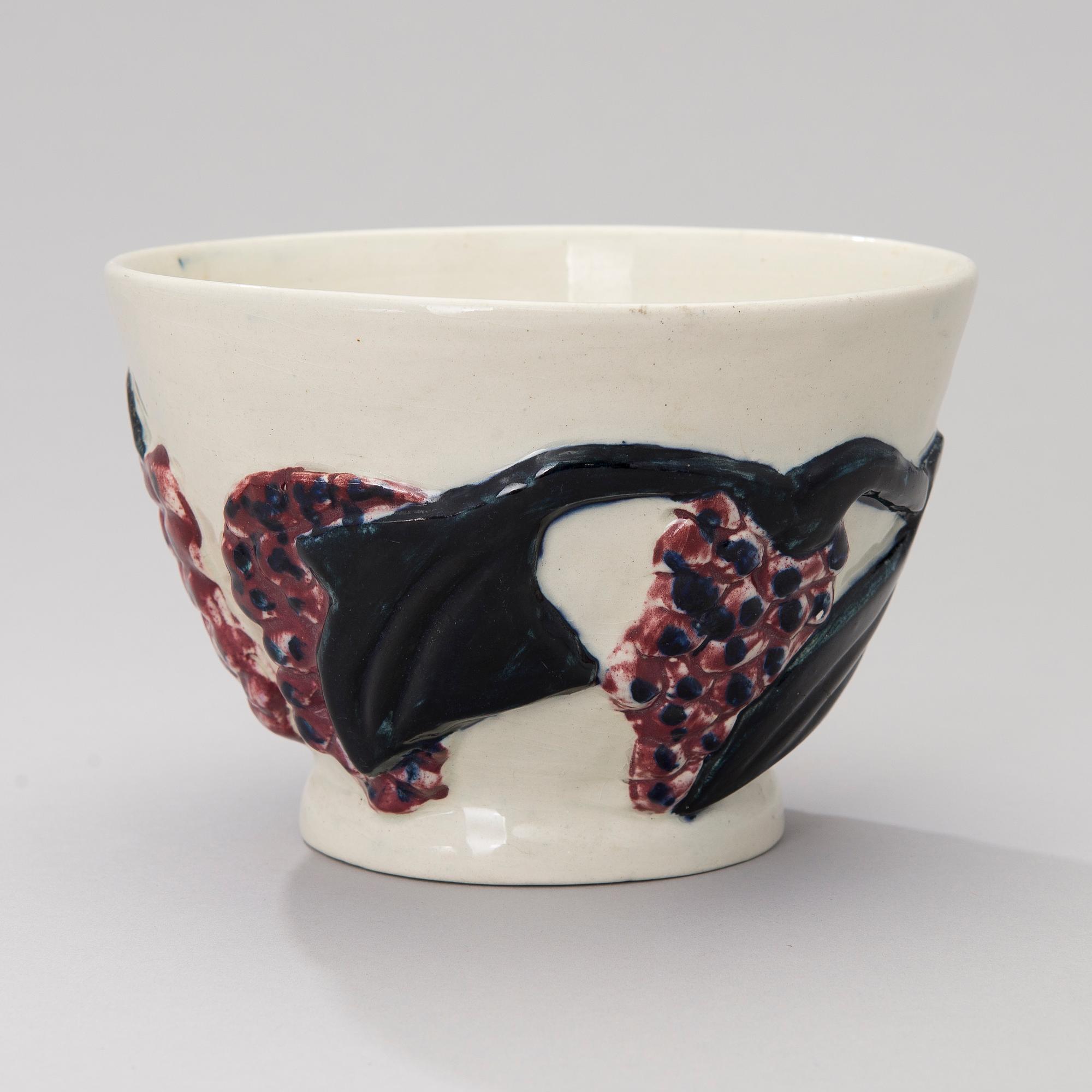 A ceramic bowl signed GT.
