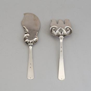 A two-piece Danish Art Nouveau silver serving set, design Thorvald Bindesbøll, maker's mark Rasmus Jensen, Horsens 1913.