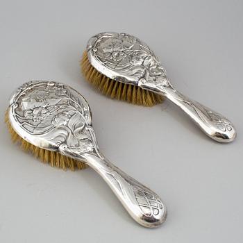 A PAIR OF ART NOUVEAU SILVER HAIR BRUSHES, Birmingham 1905.