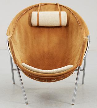 An Erik Ole Jörgensen leather and chromed steel lounge chair.