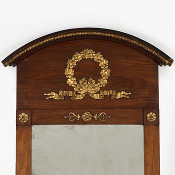 A mahogany Empire mirror, by J. Frisk (active 1805-1824).