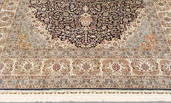 An oriental silk carpet, c. 297 x 202 cm.