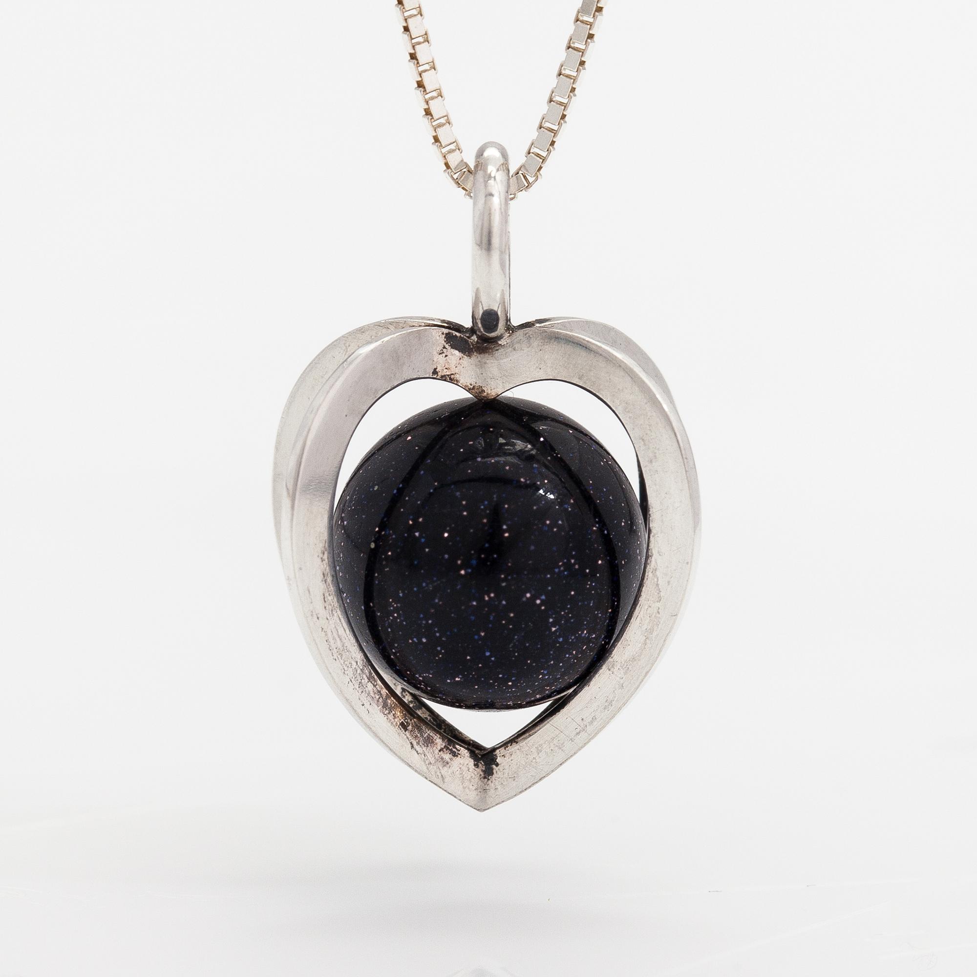 Elis Kauppi, A silver necklace with a purple goldstone. Kupittaan kulta, Turku.