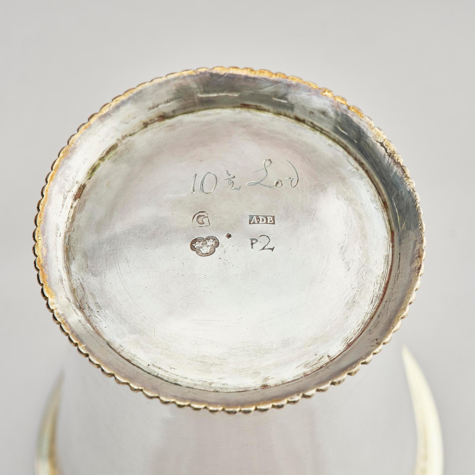 Three Swedish 18th century parcel-gilt silver beakers and a case of birch, different maker's.