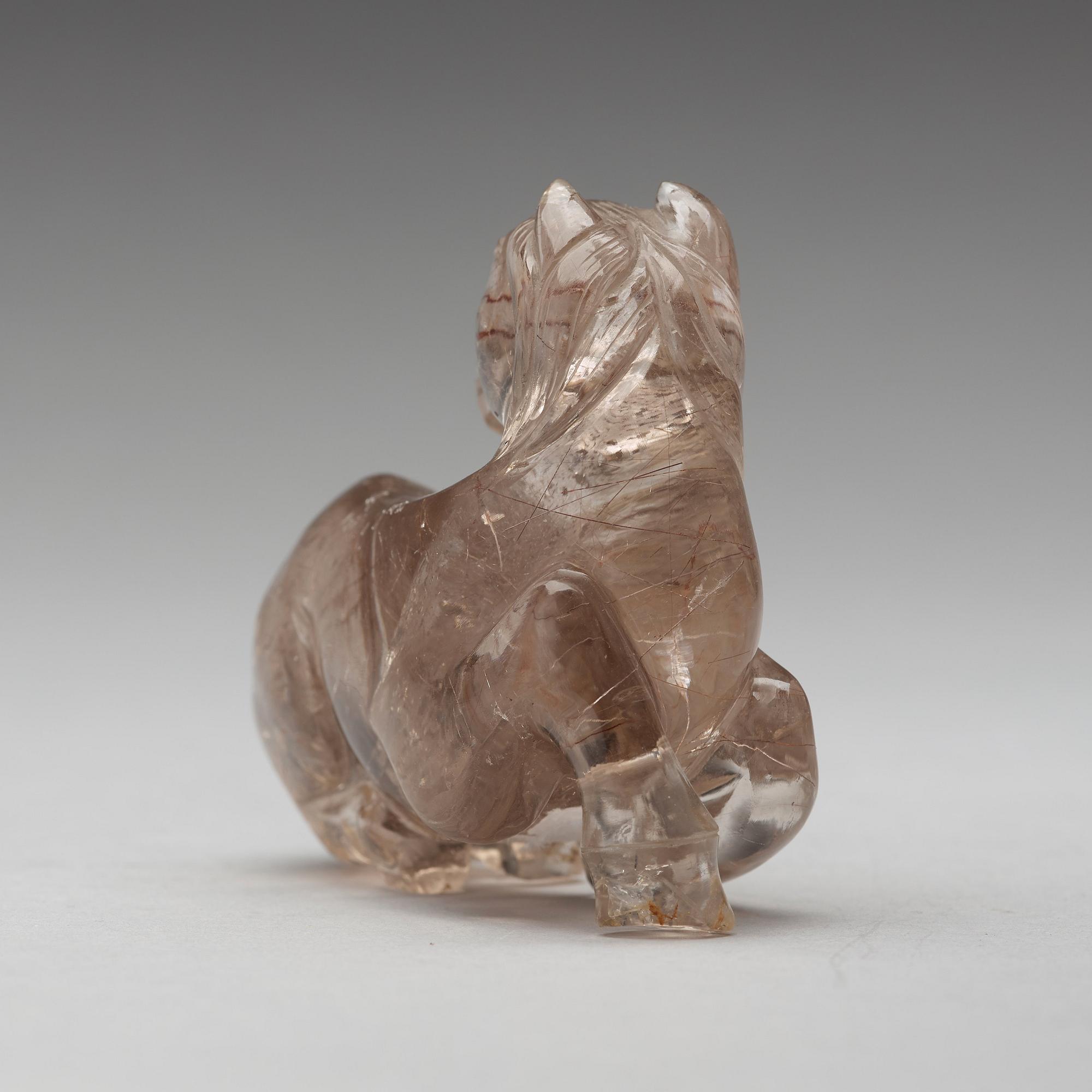 A quartz carving of a reclining horse, China.