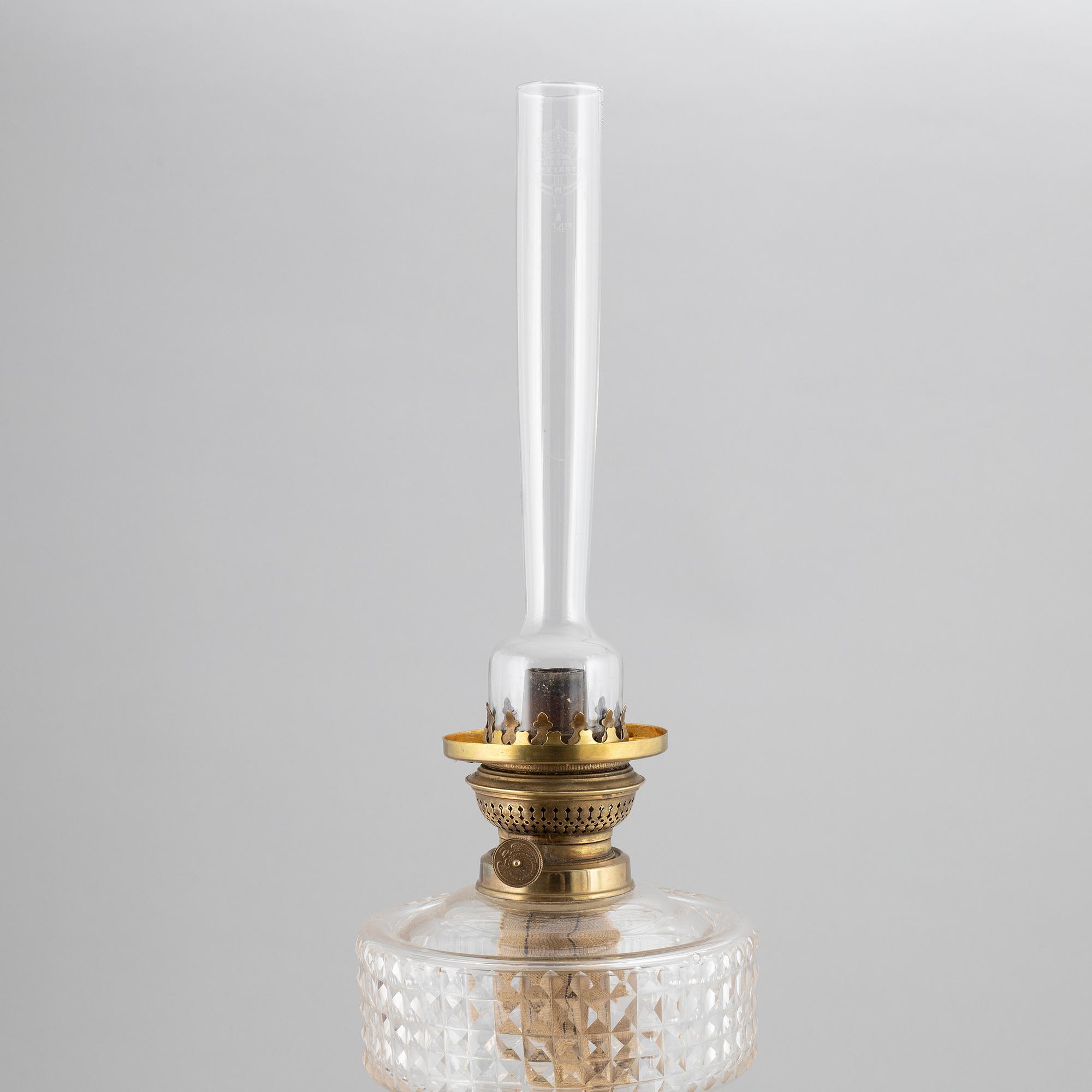 A brass oil lamp, ca 1900.