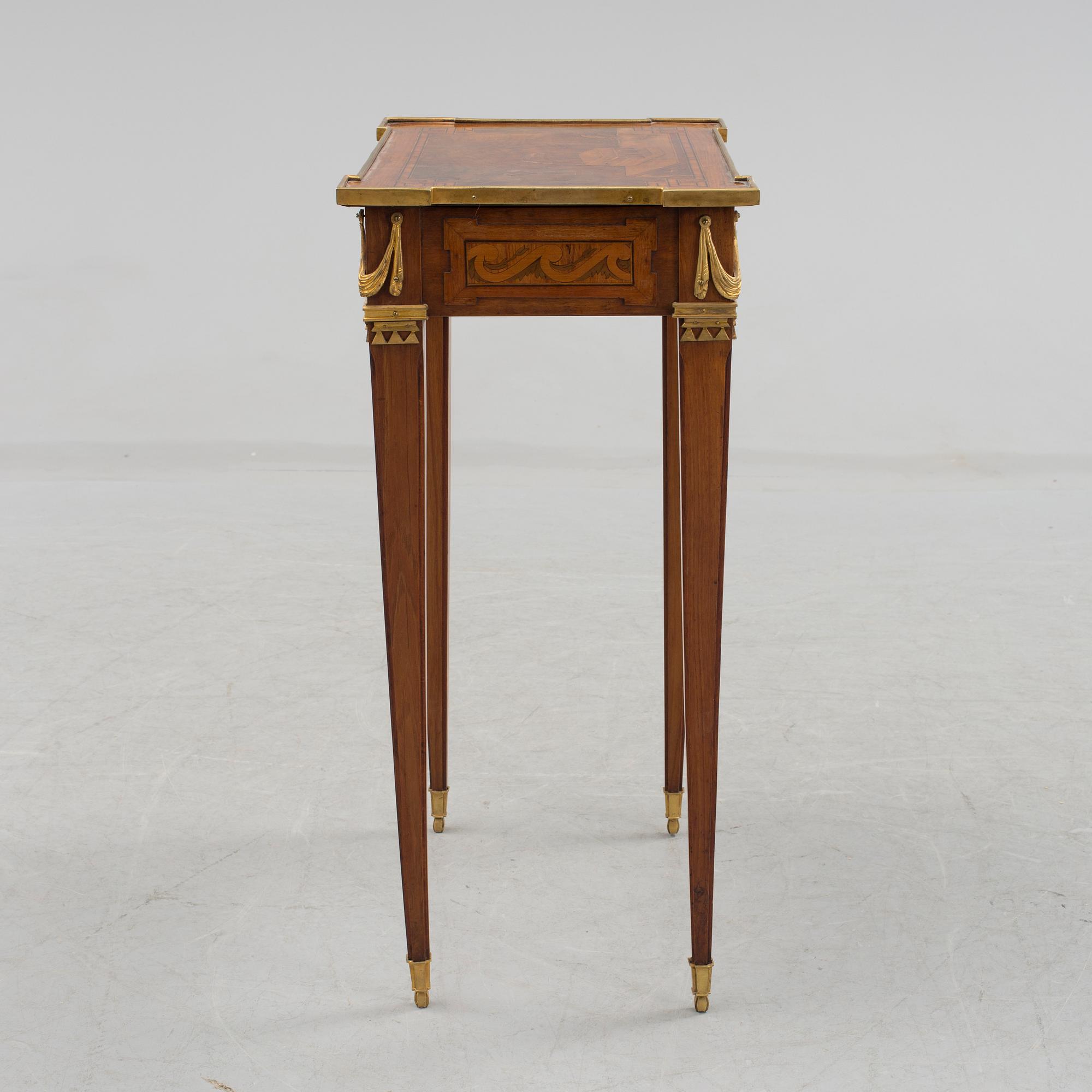 A Louis XVI-style circa 1900 occasional table.