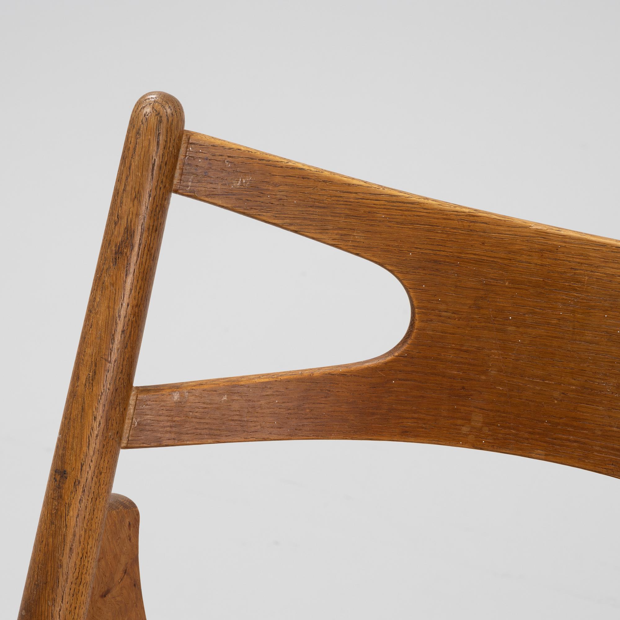 A set of six model CH 29 'Savbukstolen' by Hans J Wegner, designed 1952.