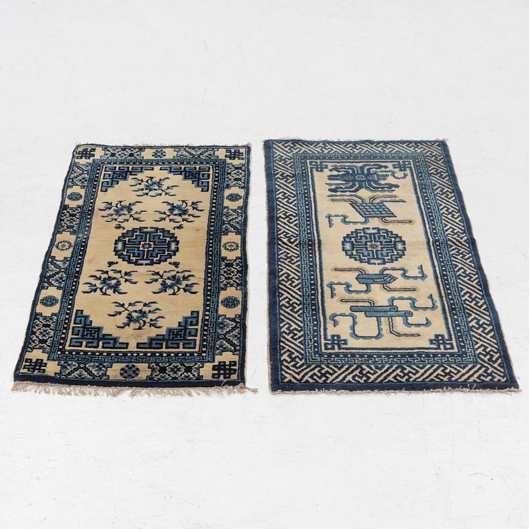 Two antique Chinese Pao-Tow rugs, c. 125 x 65 and 125 x 60 cm.