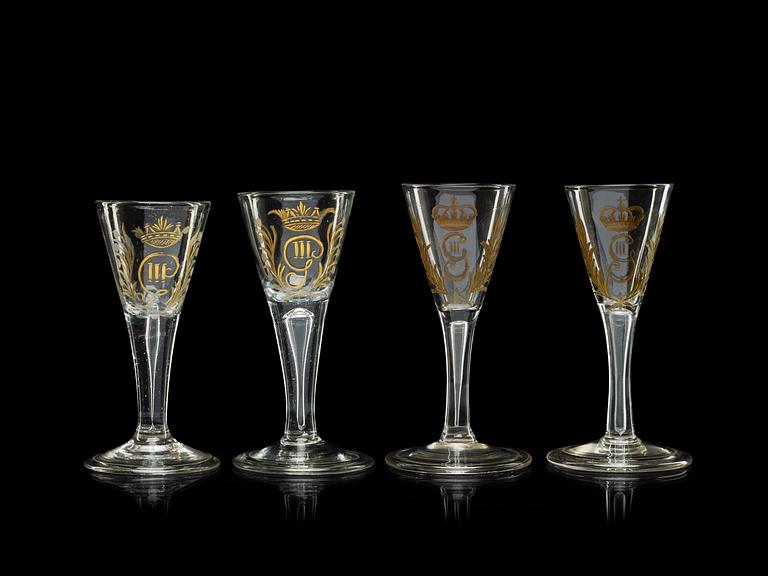 A set of four armorial wine goblets, 18th Century.