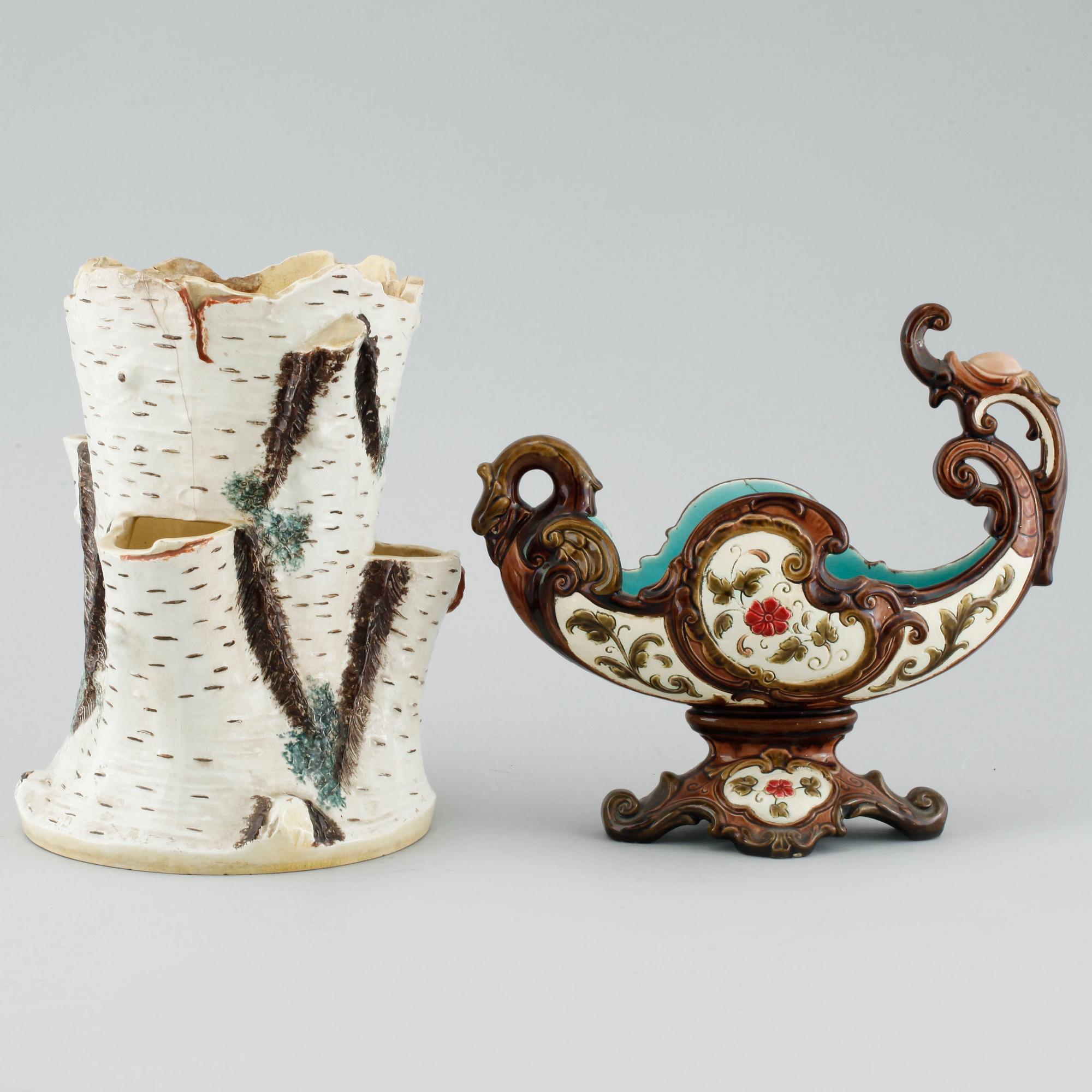 A pair of consoles, a pot and a jardinière in majolica, made by Gustavsberg and Rörstrand around year 1900.