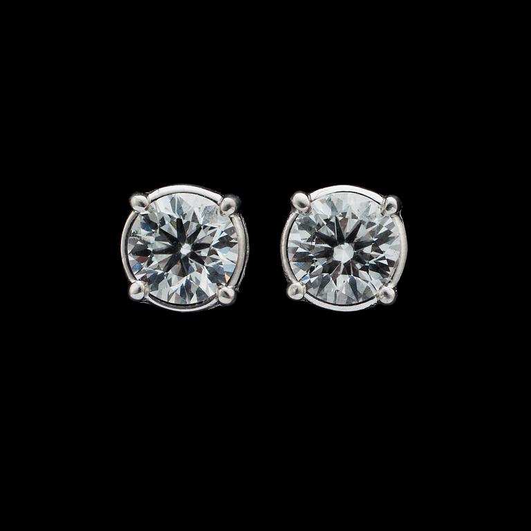 A pair of brilliant cut diamond ear studs, each 0.50 cts.