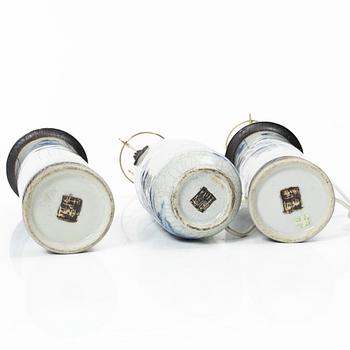 A group of three Chinese porcelain vases, two of them converted into table lamps, around 1900.