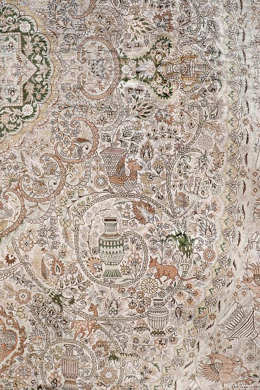 An oval pictoral silk carpet, ca 273 x 180 cm.