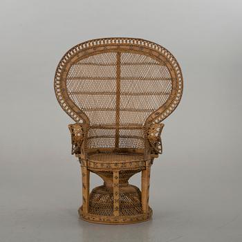 AN RATTAN ARMCHAIR.