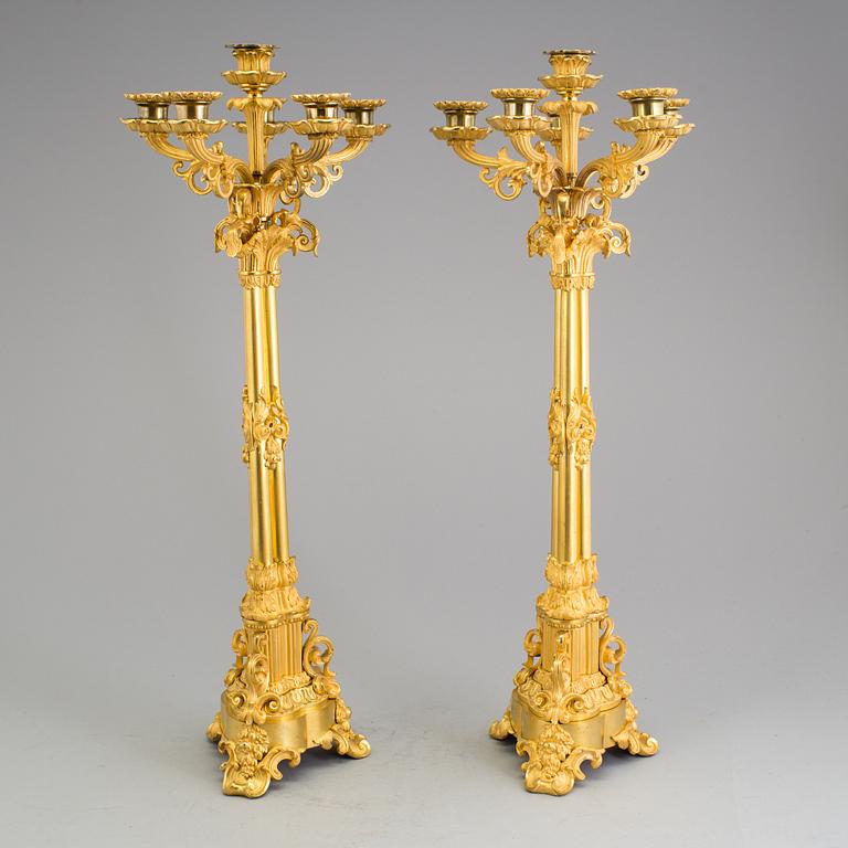 A pair of mid 19th century Empire gilt bronze candelabras.