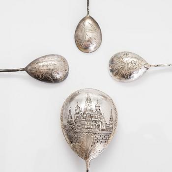 Three silver tea glass holders and four spoons, silver Kostroma and Moscow, late 19th and early 20th centuries.