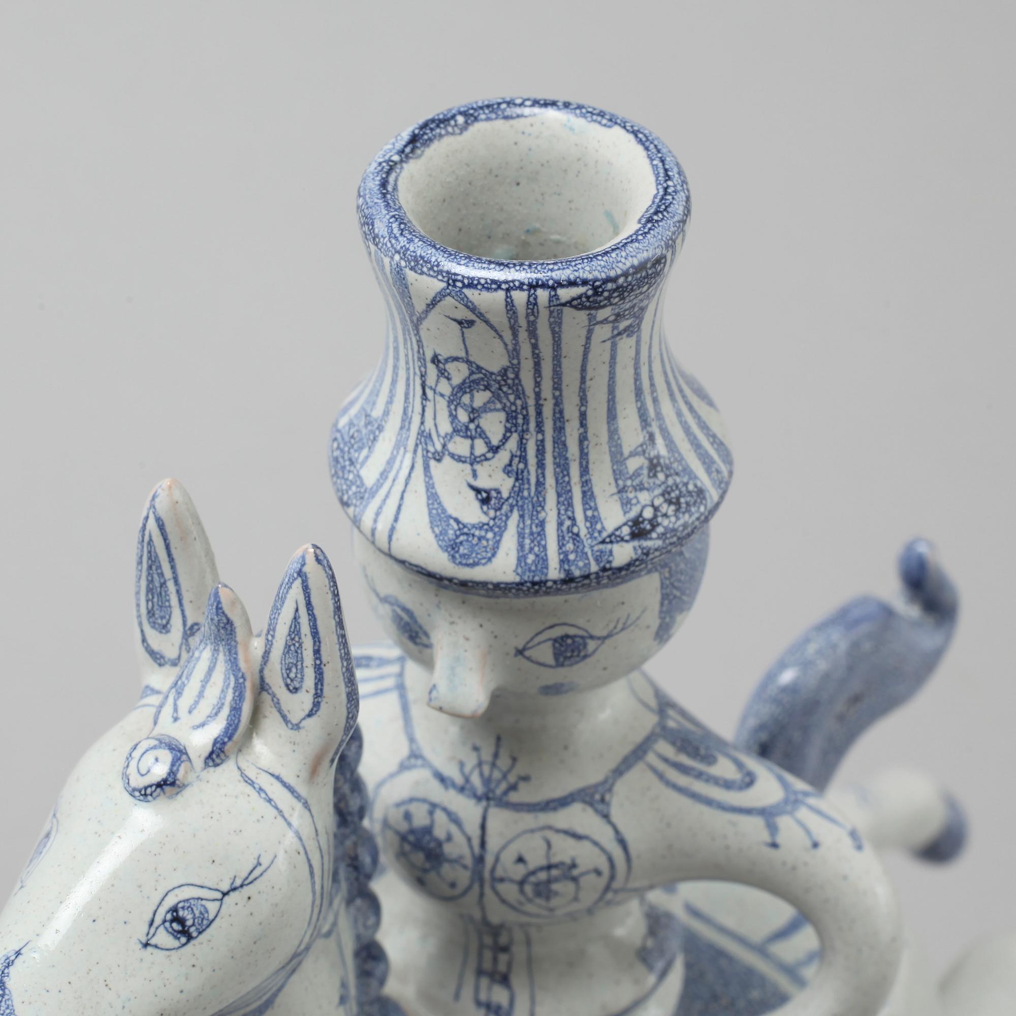 A faience candlestick and a figurine by Björn Wiinblad, signed and dated -63.