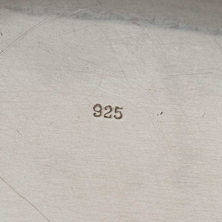 Three silver serving plates, decorated with "knots", Swedish import marks.