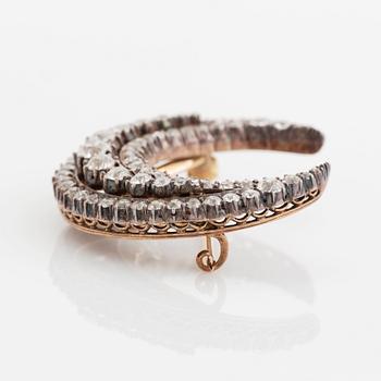 A crescent moon brooch in silver and gold set with old- and rose-cut diamonds.