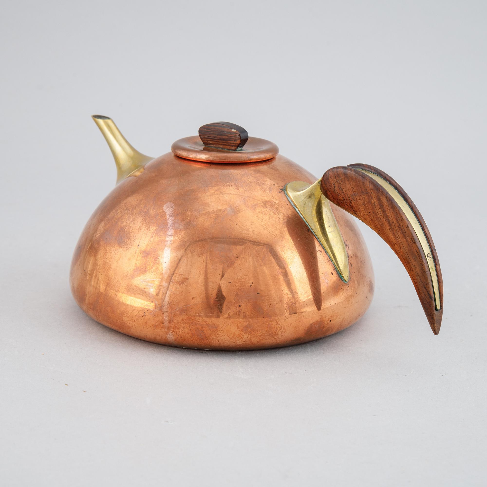 A copper, brass and rosewood teapot, Illums Bolighus, Denmark, 1950's.