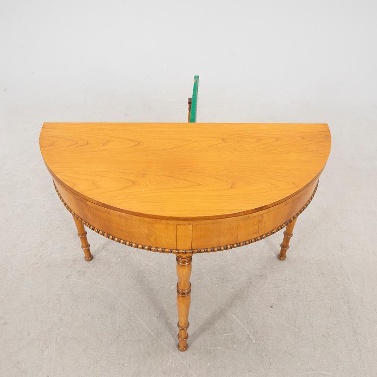 A kid 1800s late Empire birch game table.