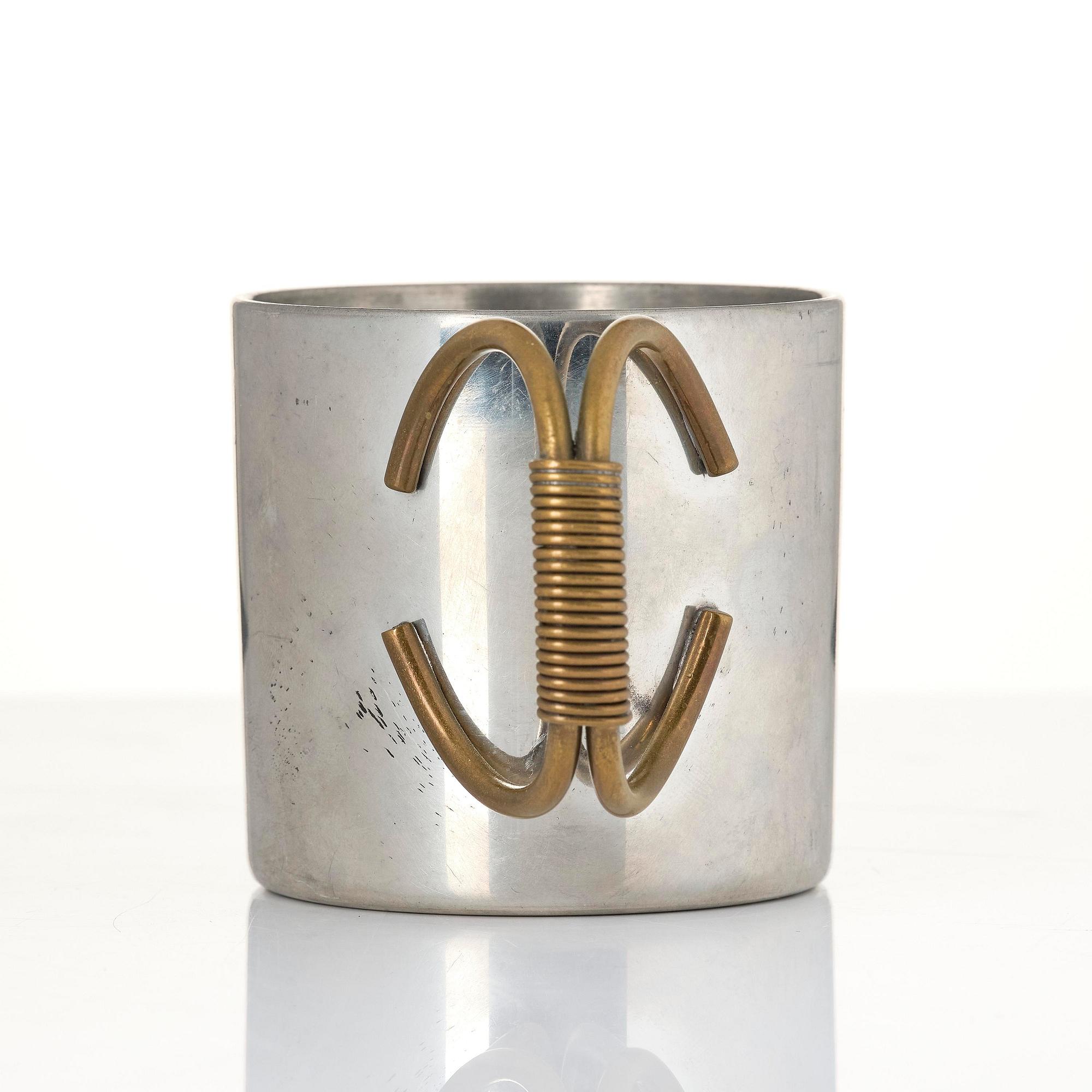 Firma Svenskt Tenn, a pewter and brass cup model "A 2196", Stockholm, 1957.
