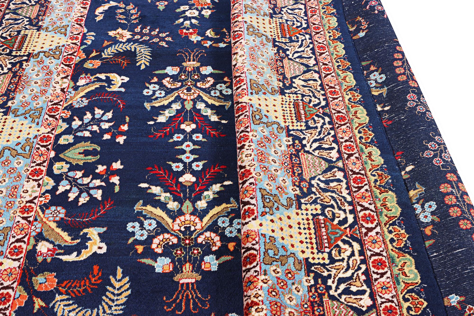A Kashmar carpet, c. 356 x 260 cm.