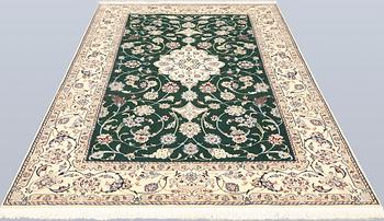 A part silk Nain rug, so-called 9LAA, approx. 257 x 161 cm.