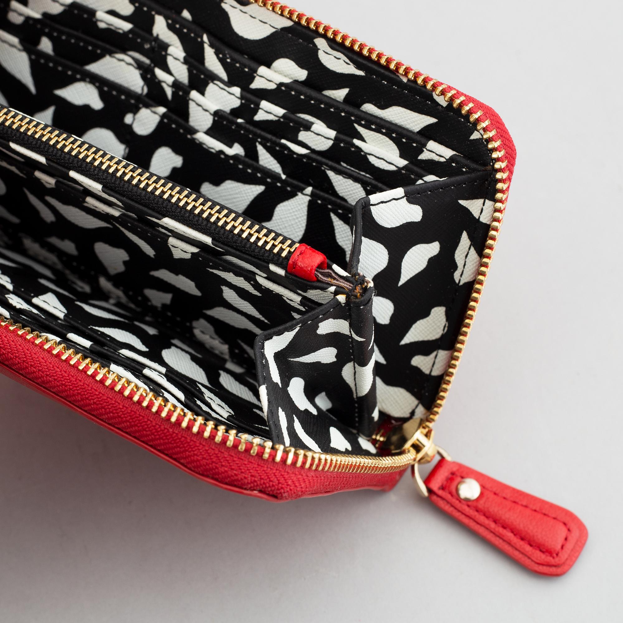 Diane von Fürstenberg a red leather handbag and wallet.