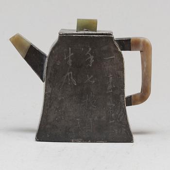 A chinese pewter tea pot with cover, early 20th Century.